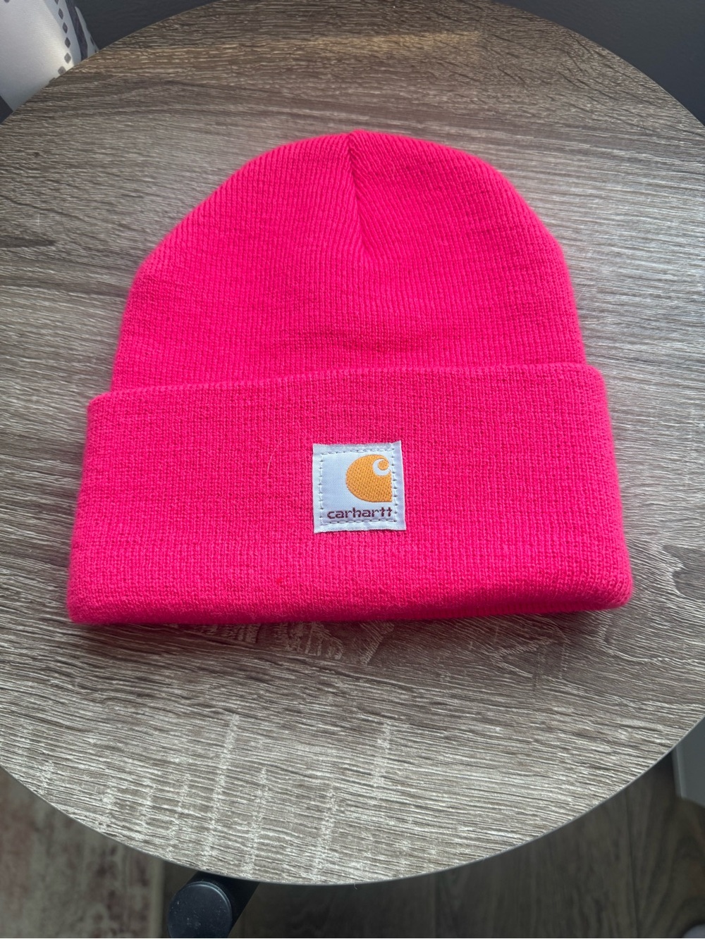 53. Carhartt classic cuffed beanie in a pink color